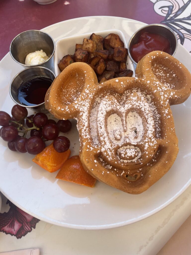  famous Mickey Mouse-shaped waffles, hearty breakfast platters, and the signature Carnation Cafe Fried Pickles